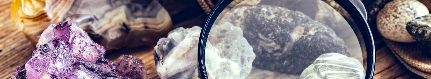 Rocks and minerals under a magnifying glass